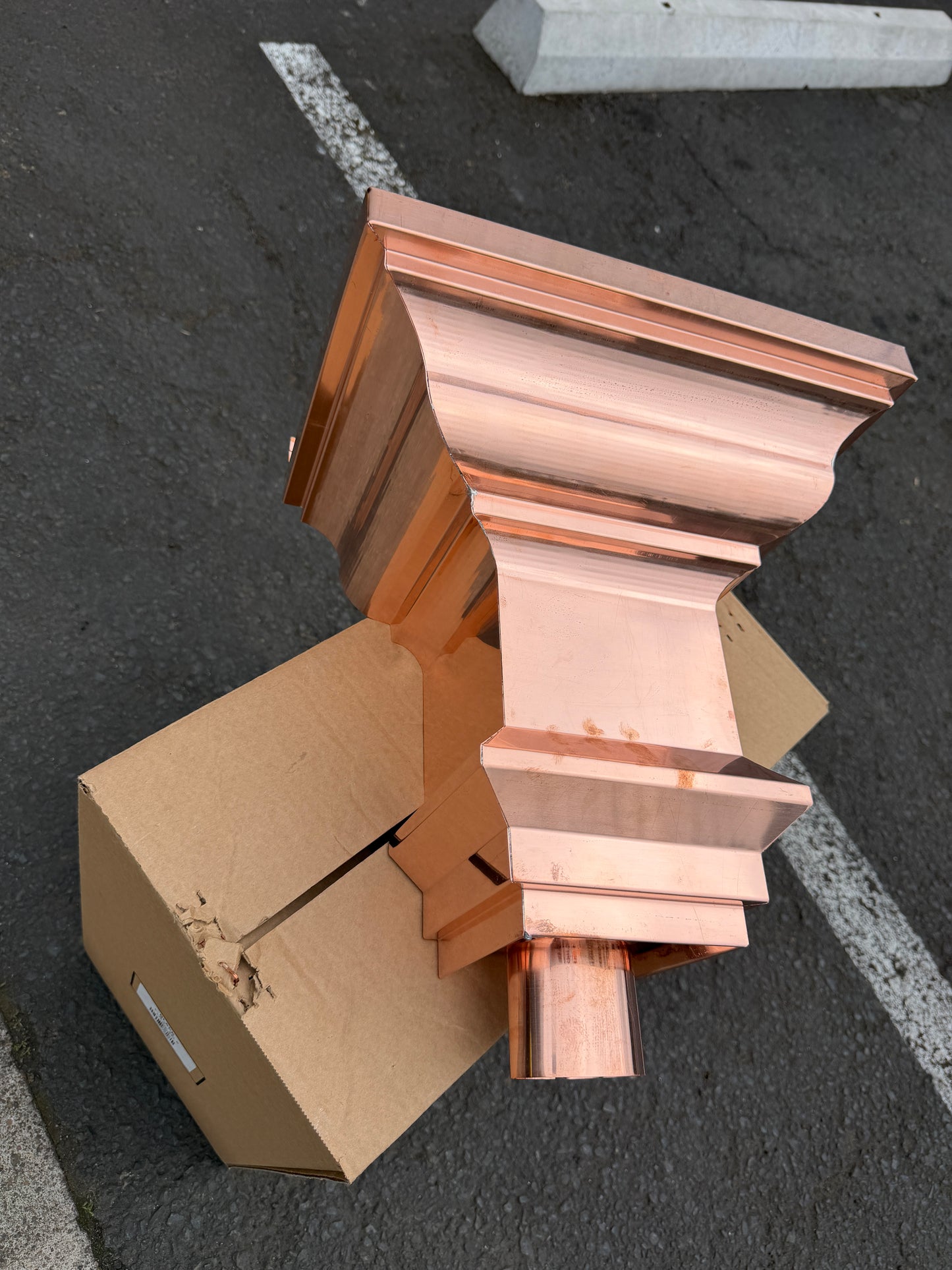 Copper conductor head crown style 14x10x14 inch leader head rain collector box featuring decorative crown profile stacked molding deep curved bowl and 2x3 oval downspout outlet in bright mill finish 16 oz copper by GutterAll Damascus Oregon