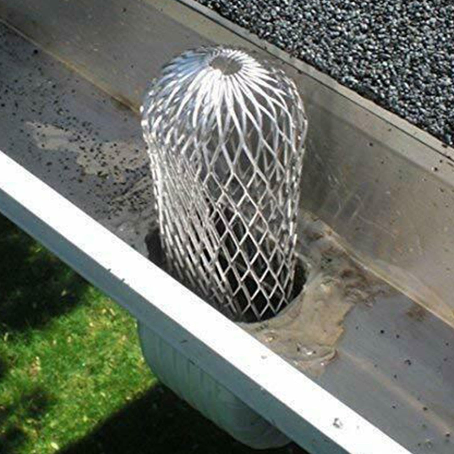 Expandable aluminum mesh downspout strainer 3 inch dome shape installed in gutter outlet blocking leaves debris filter GutterAll Damascus Oregon