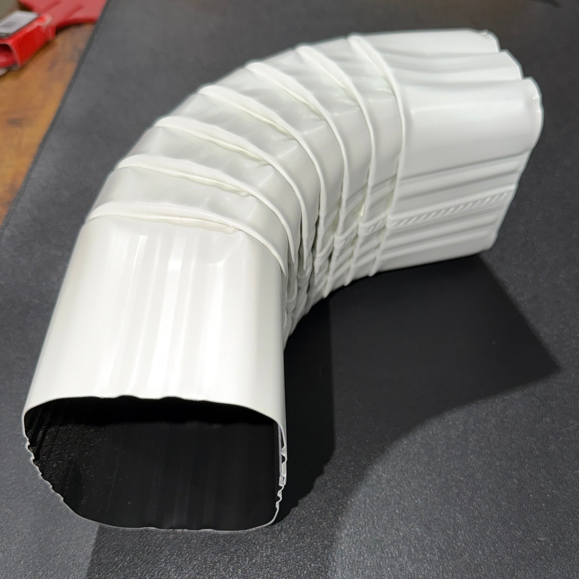 3x4 aluminum downspout elbow 75 degree Type A Style A corrugated ribbed clay brown gutter bend fitting professional grade rectangular profile high capacity drainage tight spaces deep fascia - GutterAll Damascus Oregon