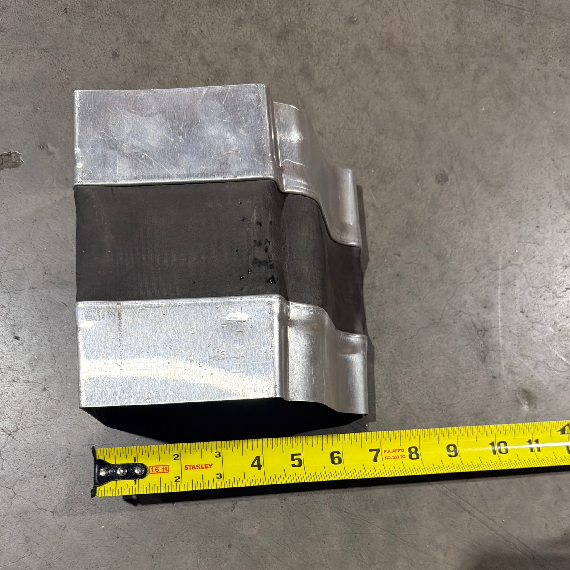 Aluminum gutter expansion joint with curved EPDM rubber flexible insert thermal protection 5 inch 6 inch K-style seamless gutter system GutterAll Damascus Oregon