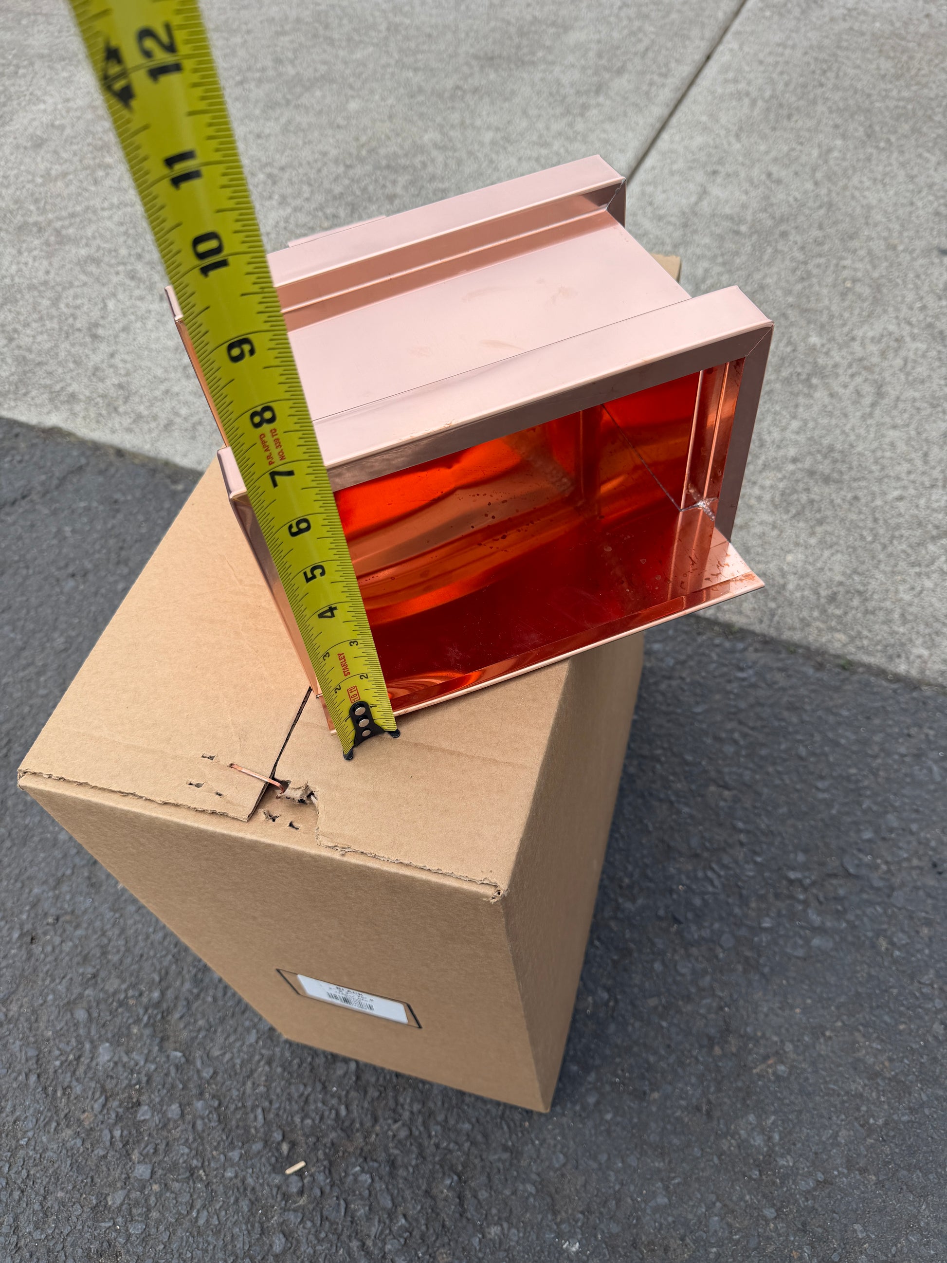 Small copper conductor head single crown style 10x6x13 inch leader head rain collector box featuring single crown top smooth curved face decorative bands and 2x3 square downspout outlet in bright mill finish 16 oz copper by GutterAll Damascus Oregon