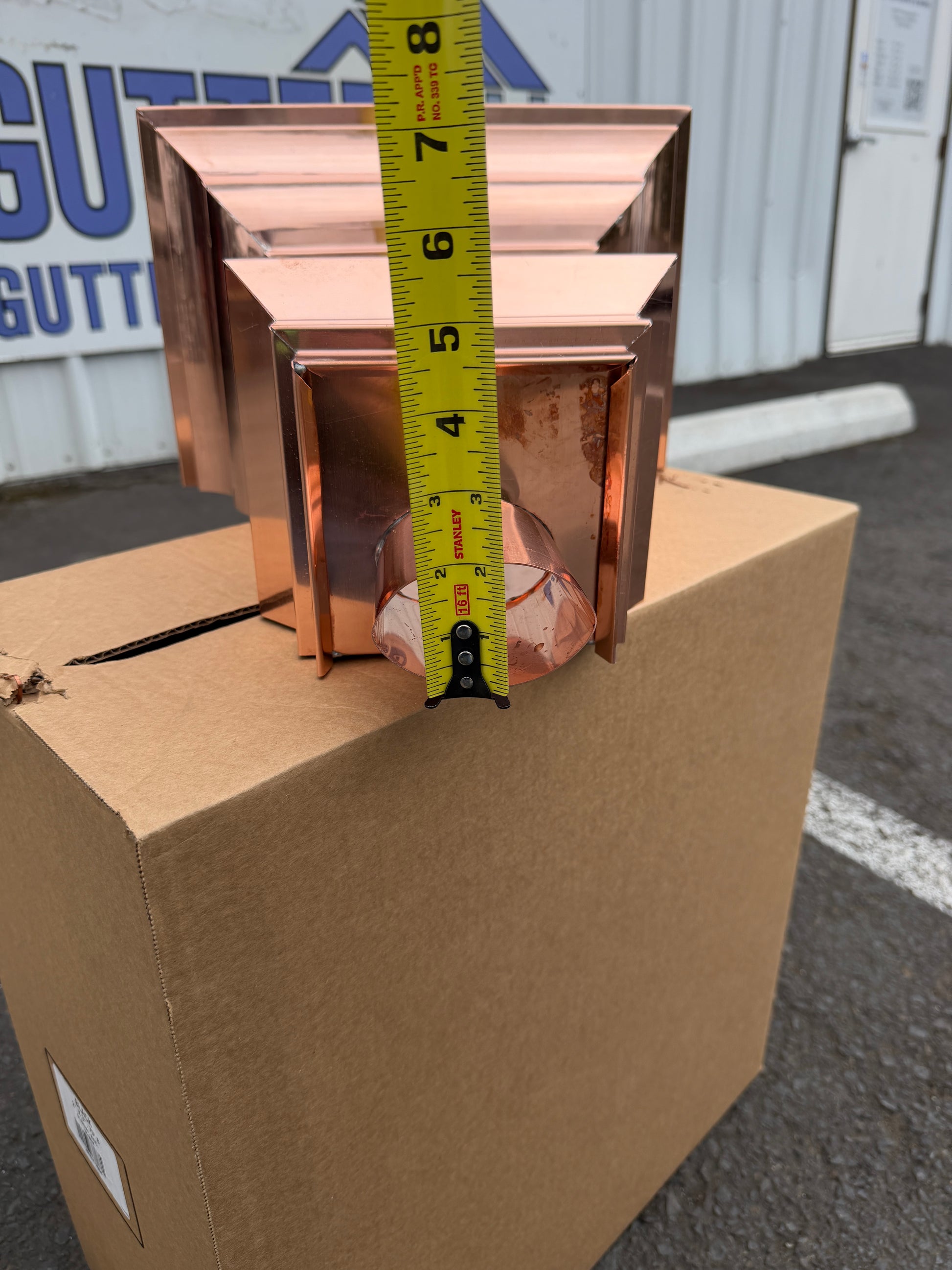 Copper conductor head crown style 14x10x14 inch leader head rain collector box featuring decorative crown profile stacked molding deep curved bowl and 2x3 oval downspout outlet in bright mill finish 16 oz copper by GutterAll Damascus Oregon