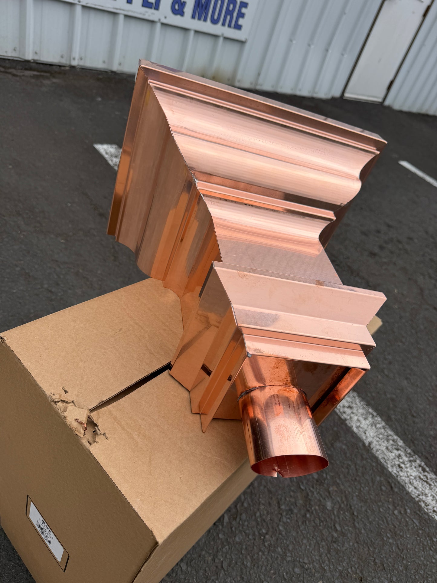 Copper conductor head crown style 14x10x14 inch leader head rain collector box featuring decorative crown profile stacked molding deep curved bowl and 2x3 oval downspout outlet in bright mill finish 16 oz copper by GutterAll Damascus Oregon