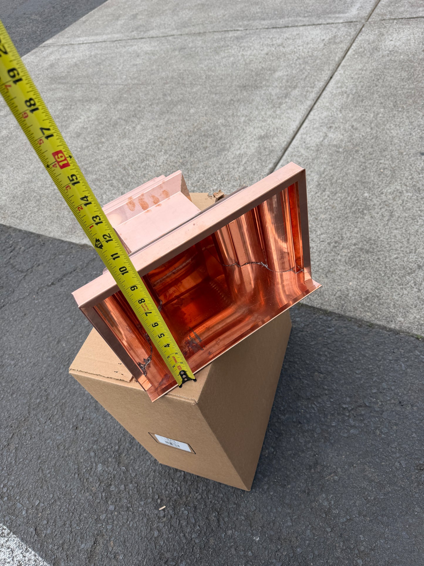 Copper conductor head crown style 14x10x14 inch leader head rain collector box featuring decorative crown profile stacked molding deep curved bowl and 2x3 oval downspout outlet in bright mill finish 16 oz copper by GutterAll Damascus Oregon