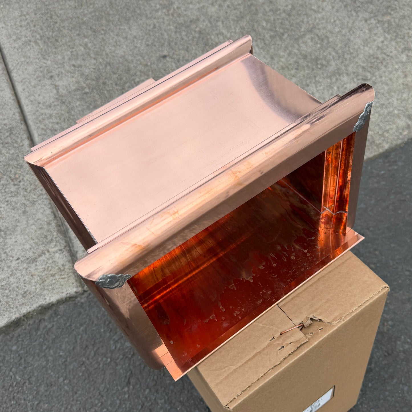 Copper conductor head leader head rain head collection box 14 inch single crown top smooth front flared body 2x3 oval downspout connection architectural gutter accessory premium residential commercial Damascus Oregon GutterAll