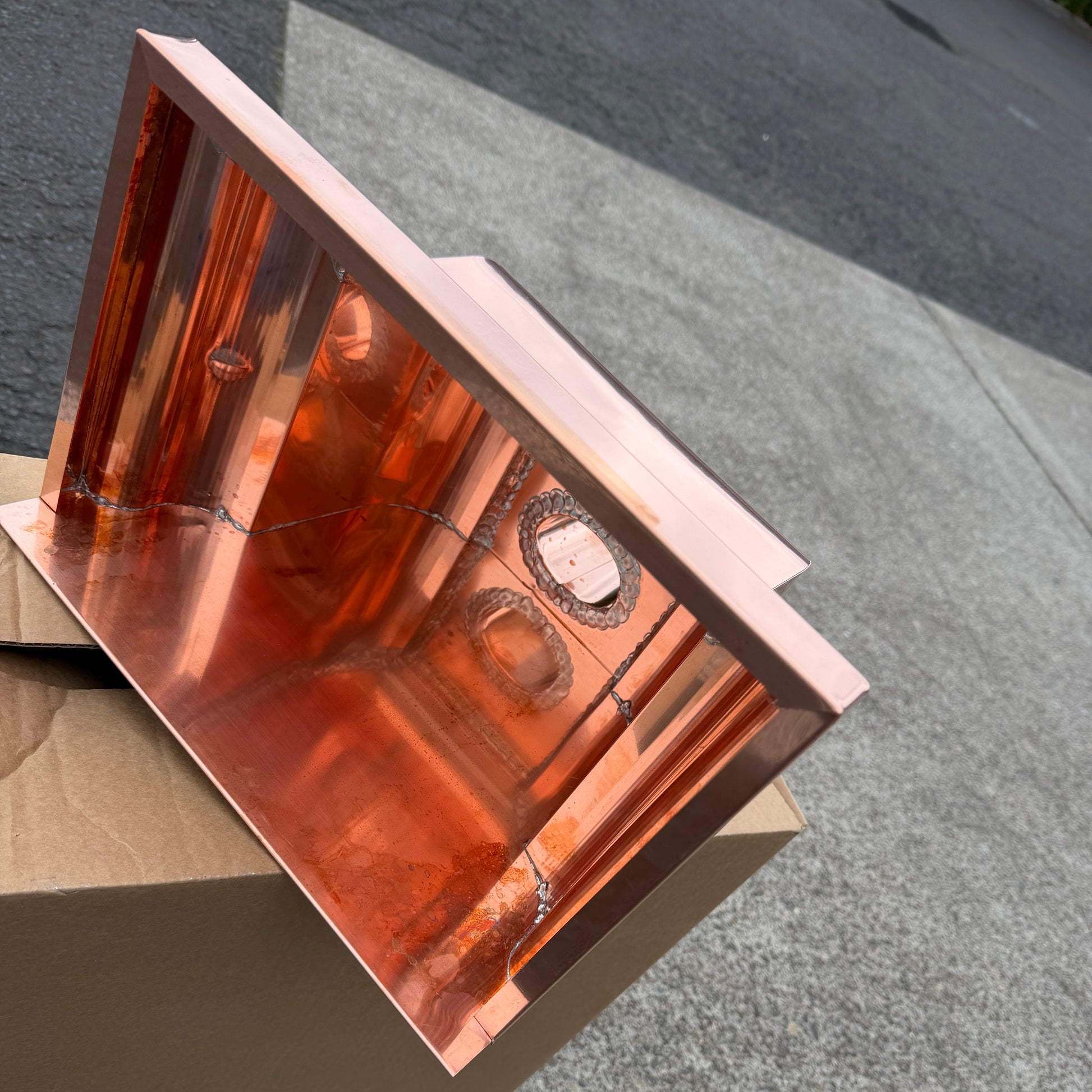 Copper conductor head leader head rain collector box 14x10x11 inch crown molding design smooth curved front 2x3 oval outlet polished copper finish architectural gutter accessory custom homes upscale remodels GutterAll Damascus Oregon