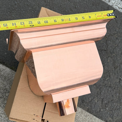 Copper conductor head leader head rain collector box 14x10x11 inch crown molding design smooth curved front 2x3 oval outlet polished copper finish architectural gutter accessory custom homes upscale remodels GutterAll Damascus Oregon
