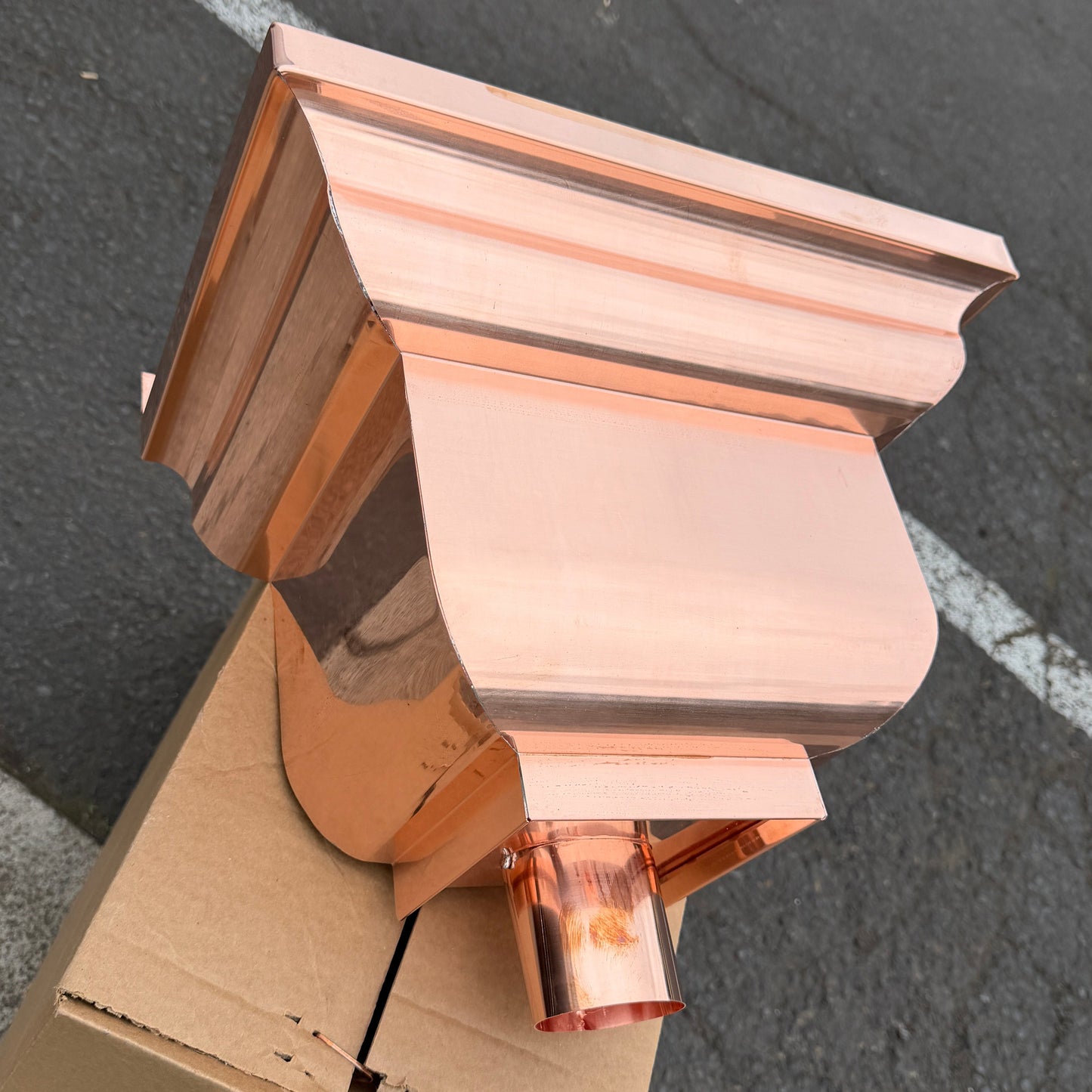 Copper conductor head leader head rain collector box 14x10x11 inch crown molding design smooth curved front 2x3 oval outlet polished copper finish architectural gutter accessory custom homes upscale remodels GutterAll Damascus Oregon