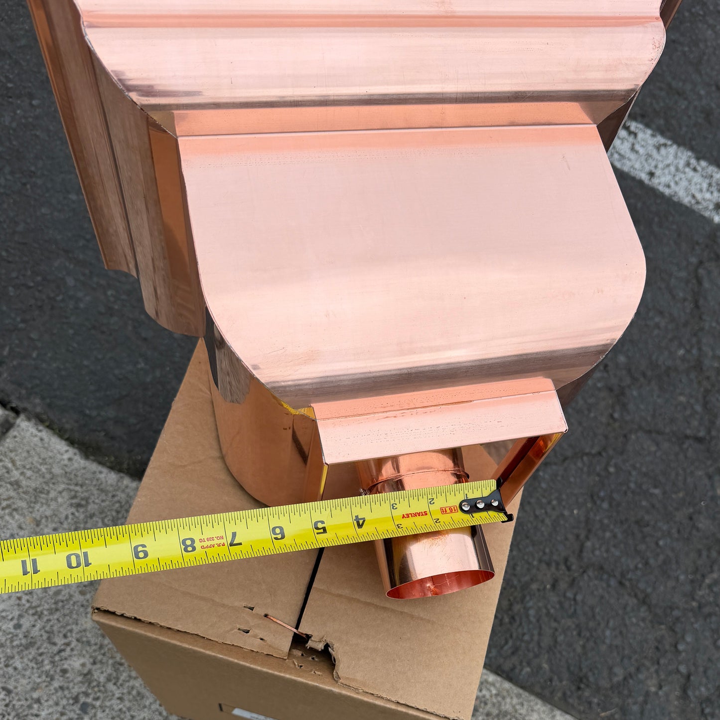 Copper conductor head leader head rain collector box 14x10x11 inch crown molding design smooth curved front 2x3 oval outlet polished copper finish architectural gutter accessory custom homes upscale remodels GutterAll Damascus Oregon