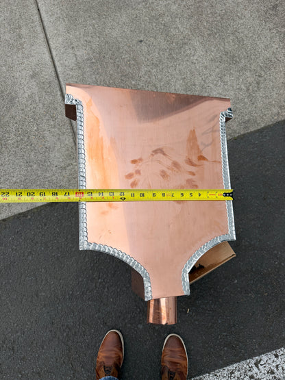 Ornamental copper conductor head with scroll cut decorative lattice front panel 18x8.5x20 inch leader head rain collector box featuring peaked gabled top faceted hexagonal body and 2x3 oval downspout outlet in bright mill finish 16 oz copper by GutterAll Damascus Oregon