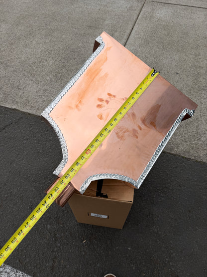 Ornamental copper conductor head with scroll cut decorative lattice front panel 18x8.5x20 inch leader head rain collector box featuring peaked gabled top faceted hexagonal body and 2x3 oval downspout outlet in bright mill finish 16 oz copper by GutterAll Damascus Oregon
