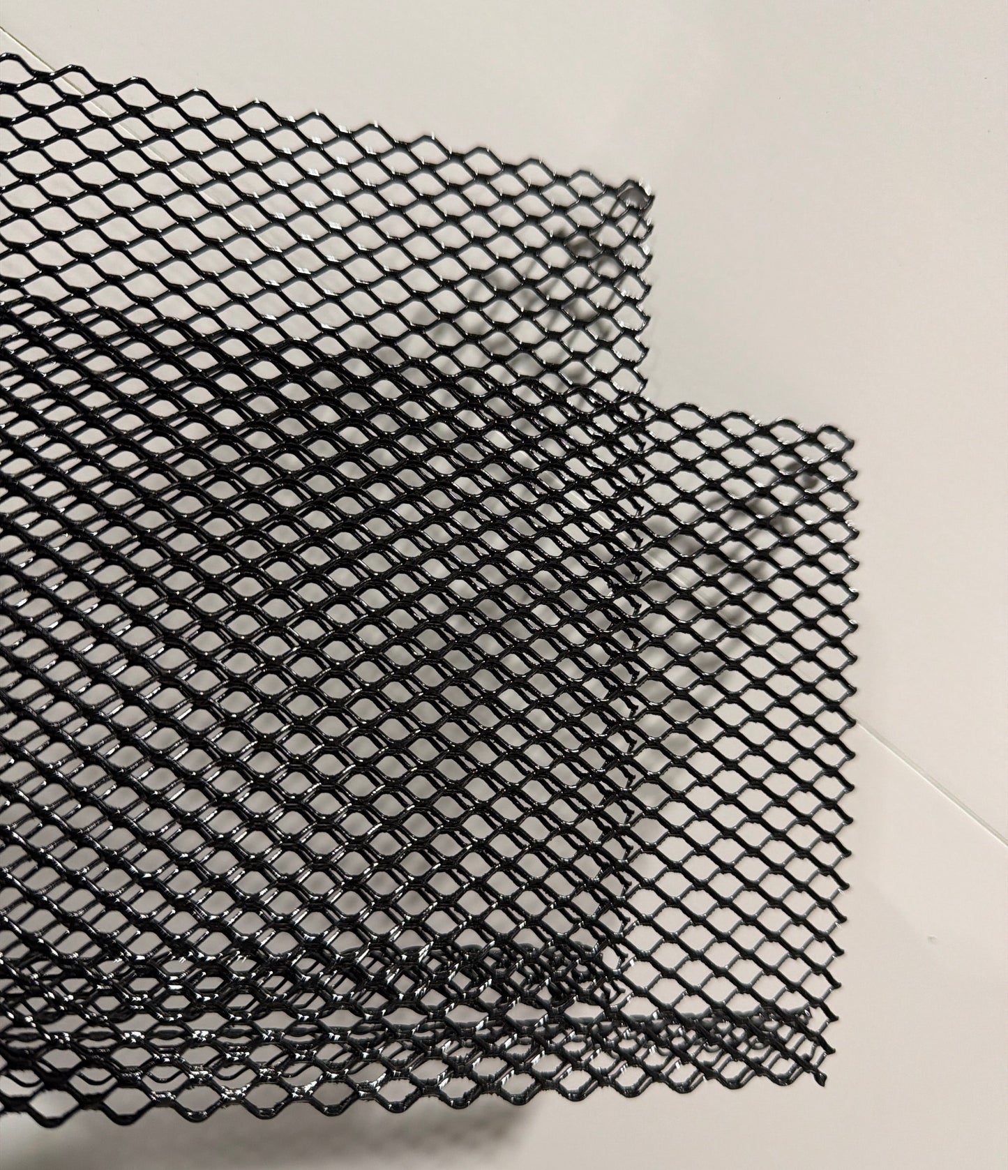 E-Z Lock Premium Gutter Guard with black finish and diamond pattern for gutter guard debris protection.