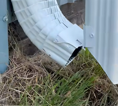 Flip-up downspout extension hinge allows easy mowing and landscaping. No more tripping hazards or mower damage. Flip down for automatic foundation protection.