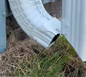 Flip-up downspout extension hinge allows easy mowing and landscaping. No more tripping hazards or mower damage. Flip down for automatic foundation protection.