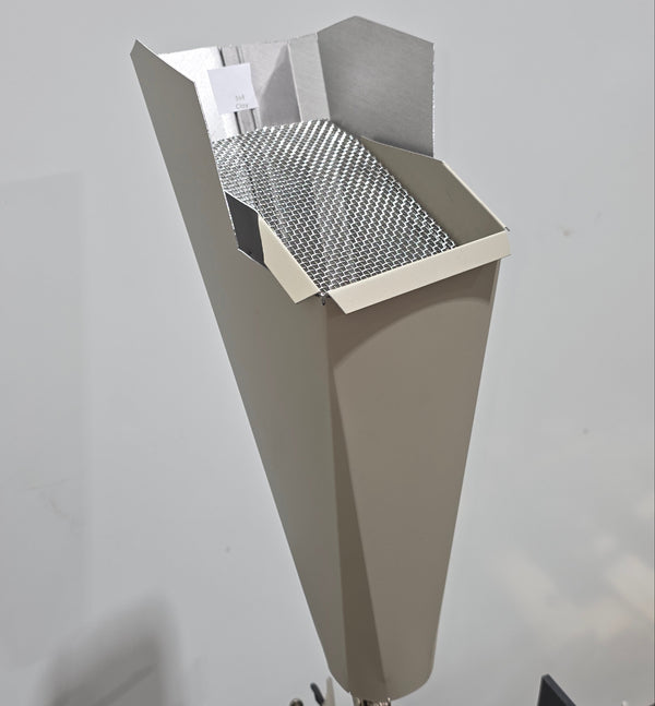 Clay aluminum gutter downspout cleanout with debris screen filtering leaves before the downspout.