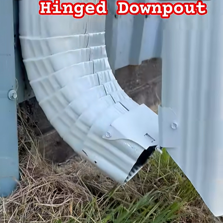 Hinged downspout extension flipped up 90 degrees out of the way for easy lawn mowing and landscaping