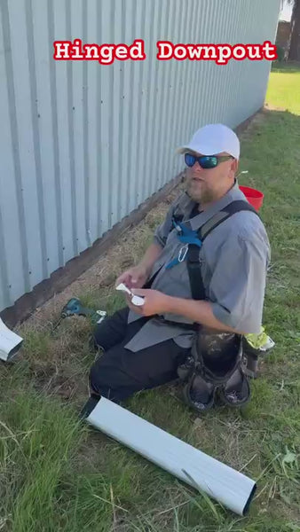 Expert presenter in Portland Oregon demonstrating best downspout extension kit 2025 
comparing flip-up aluminum hinge versus plastic alternatives for foundation protection 
and water drainage solution
