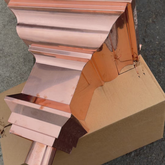 Copper conductor head crown style 14x10x14 inch leader head rain collector box featuring decorative crown profile stacked molding deep curved bowl and 2x3 oval downspout outlet in bright mill finish 16 oz copper by GutterAll Damascus Oregon