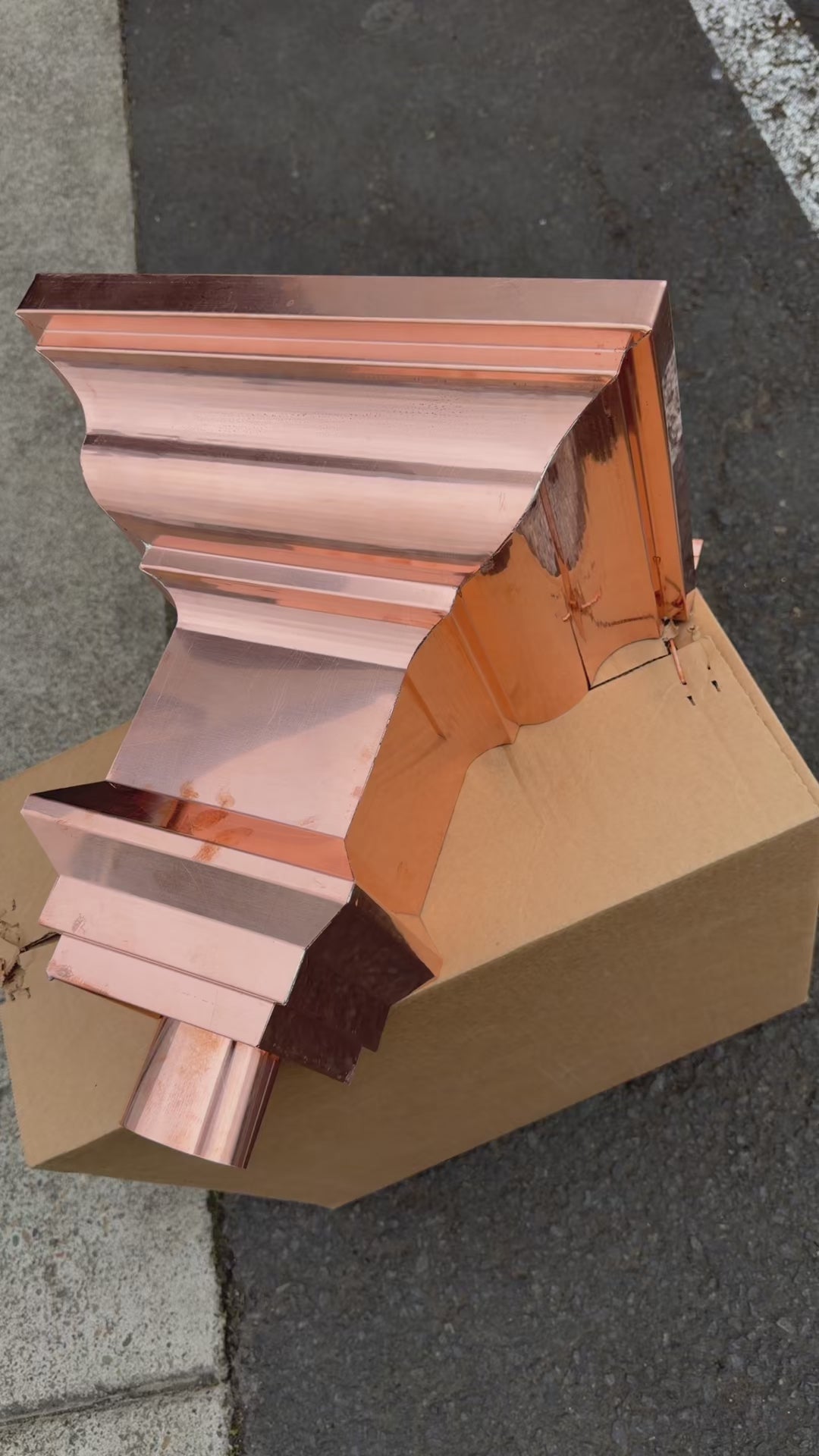 Copper conductor head crown style 14x10x14 inch leader head rain collector box featuring decorative crown profile stacked molding deep curved bowl and 2x3 oval downspout outlet in bright mill finish 16 oz copper by GutterAll Damascus Oregon