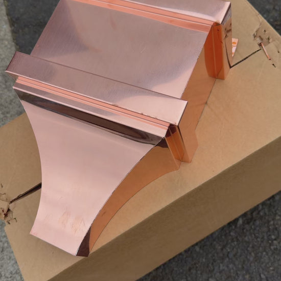 Small copper conductor head single crown style 10x6x13 inch leader head rain collector box featuring single crown top smooth curved face decorative bands and 2x3 square downspout outlet in bright mill finish 16 oz copper by GutterAll Damascus Oregon