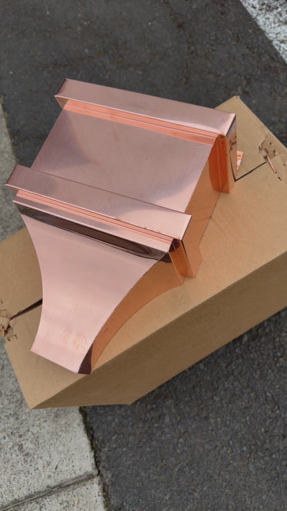 Small copper conductor head single crown style 10x6x13 inch leader head rain collector box featuring single crown top smooth curved face decorative bands and 2x3 square downspout outlet in bright mill finish 16 oz copper by GutterAll Damascus Oregon