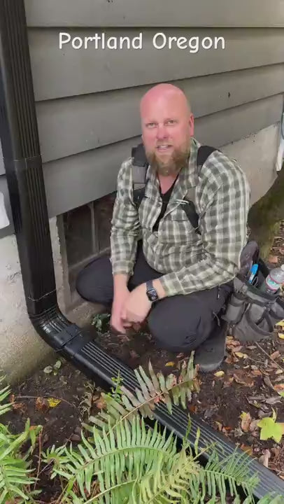 DIY downspout installation demonstration showing flip-up aluminum hinge in action 
preventing foundation damage with easy hands-on setup at residential property showing 
water drainage solution and landscaping application
