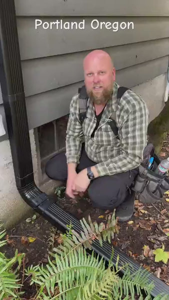DIY downspout installation demonstration showing flip-up aluminum hinge in action 
preventing foundation damage with easy hands-on setup at residential property showing 
water drainage solution and landscaping application
