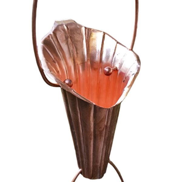 Handcrafted copper Lotus Flower Rain Chain showcasing intricate petal design and water flow in a garden setting