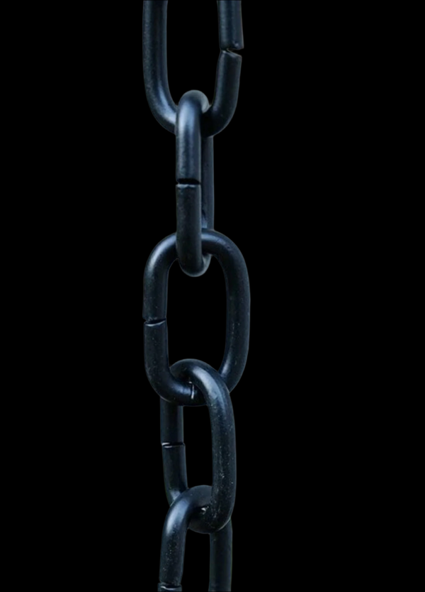 Black aluminum rain chain against a dark background highlighting its design.