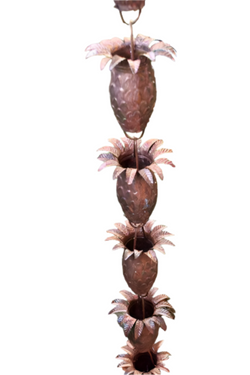 Handcrafted copper pineapple rain chain with detailed leaf crown and natural patina finish