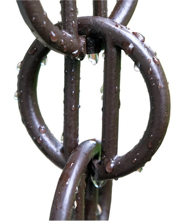 Close-up of black rain chain with water droplets on geometric rings.