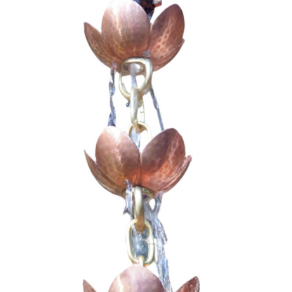 Close-up of pink lotus copper rain chain with handcrafted petals.