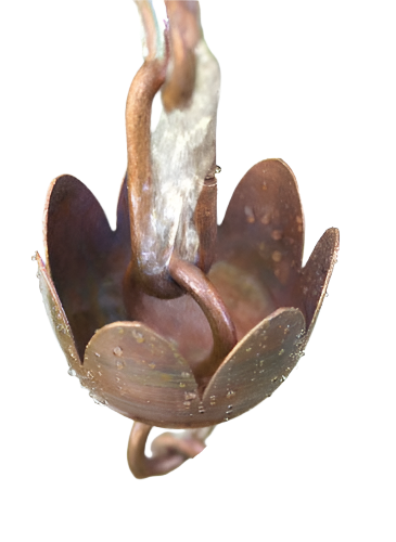 Handcrafted tulip copper cup rain chain with water droplets and rustic details.