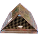 Copper triangular corner leaderhead with mesh screen for gutter drainage.