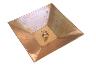 Square copper rain chain anchoring basin with hammered texture, ideal for water collection.
