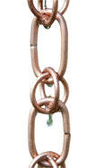 Premium copper combination link rain chain showing decorative water flow pattern and natural patina development