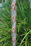 Premium copper combination link rain chain showing decorative water flow pattern and natural patina development