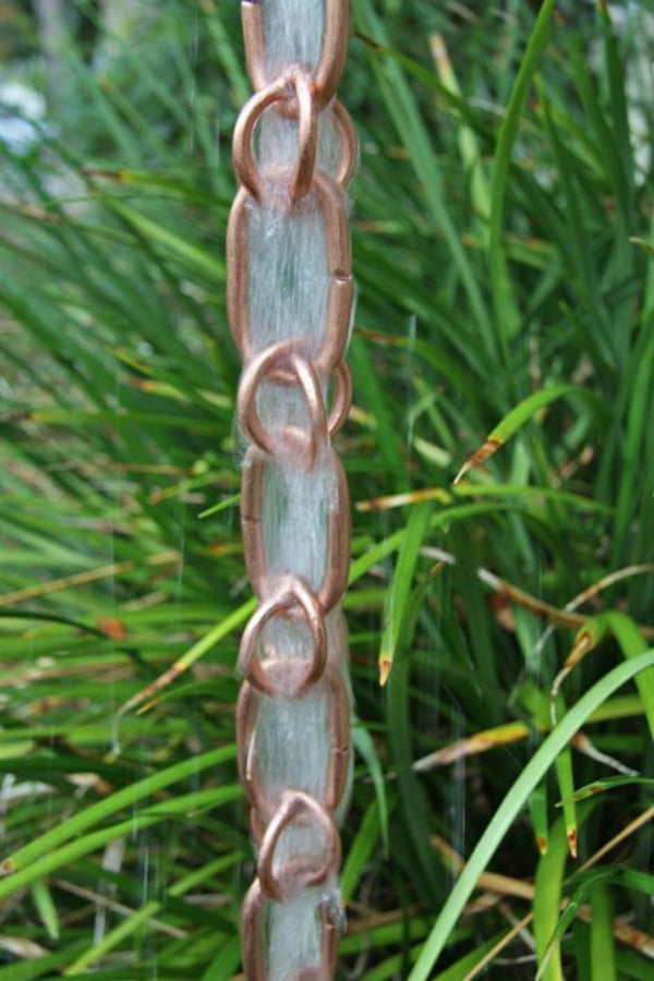 Premium copper combination link rain chain showing decorative water flow pattern and natural patina development