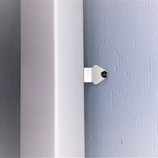 Installed downspout mounting cleat bracket securing a gutter system.