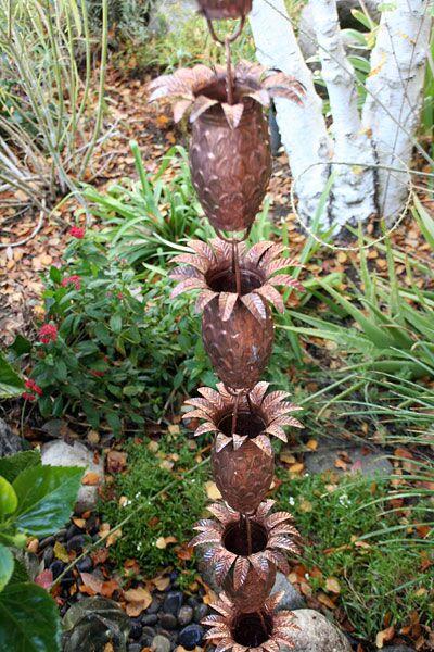 Handcrafted copper pineapple rain chain with detailed leaf crown and natural patina finish