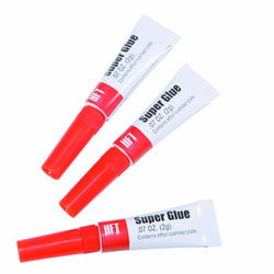 Super Glue 3-piece set with red and white tubes for strong adhesive needs.