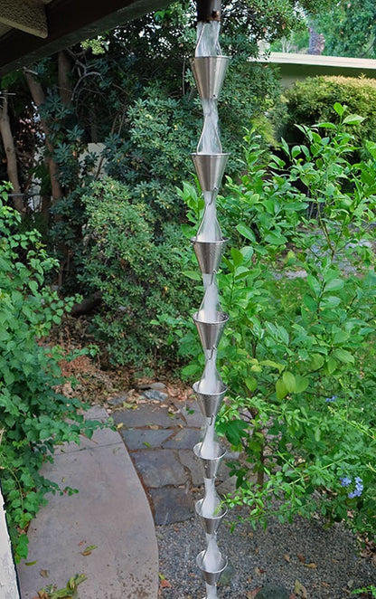 Full view of stainless steel rain chain installed as a downspout alternative.